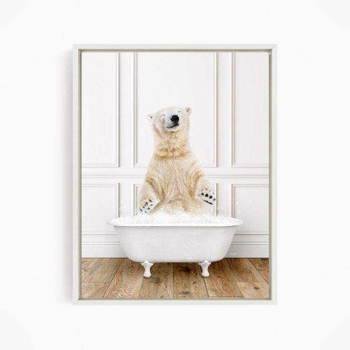 A polar bear standing in a white bathtub filled with water, appearing to enjoy the bath.