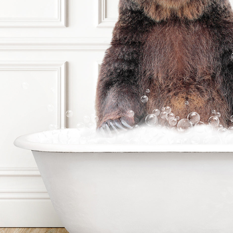 a brown bear sitting in a bathtub full of bubbles