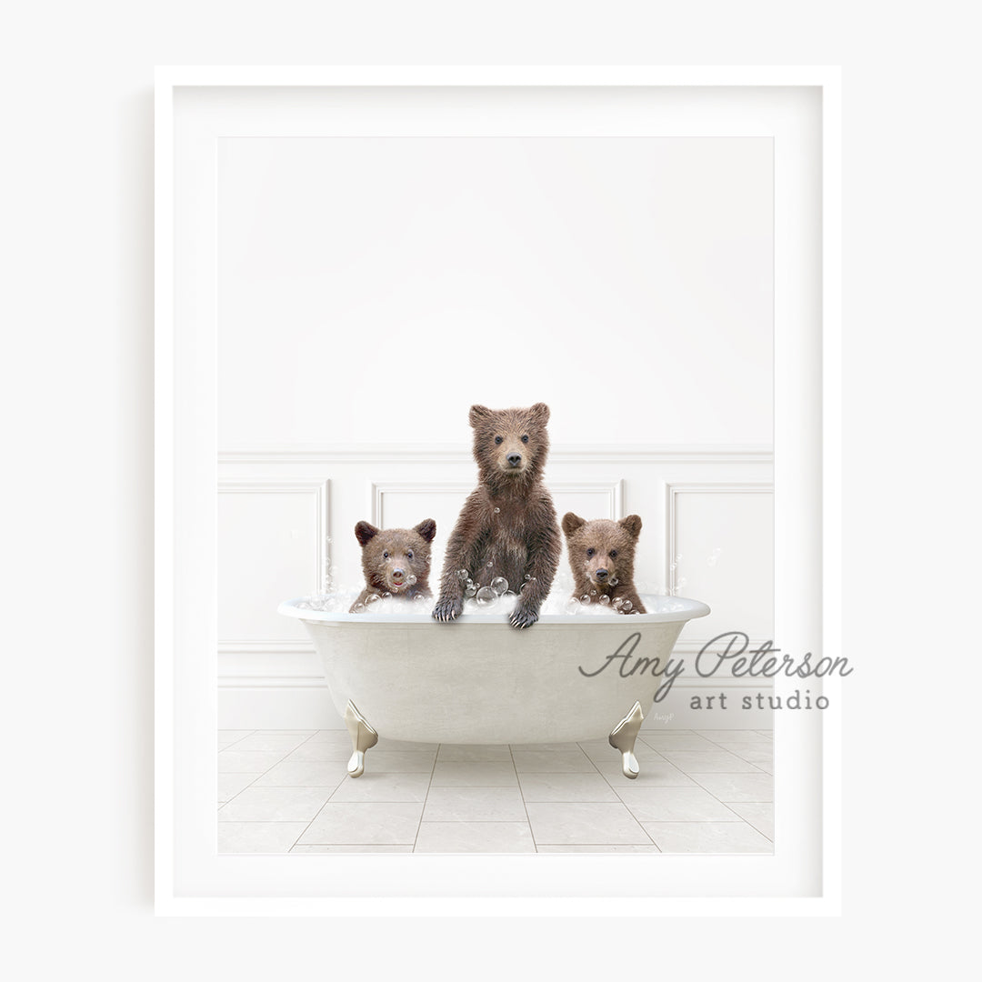 a family of three bears sitting in a bathtub