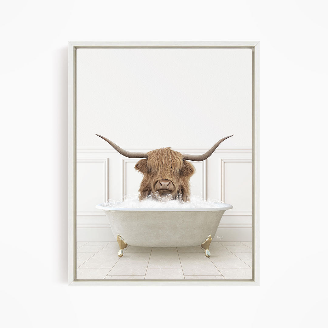 A horned animal, possibly a yak or a yakdog, is sitting in a white bathtub filled with water, with its horns raised above its head.