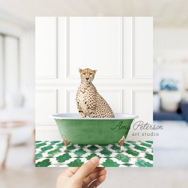 a hand holding up a card with a cheetah sitting in a bathtub