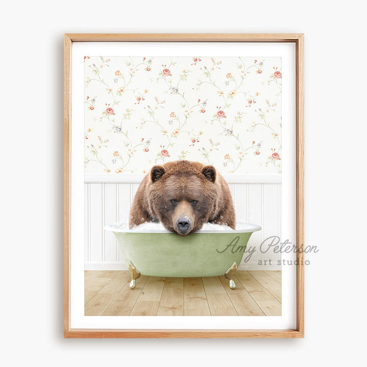 a brown bear sitting in a green bath tub