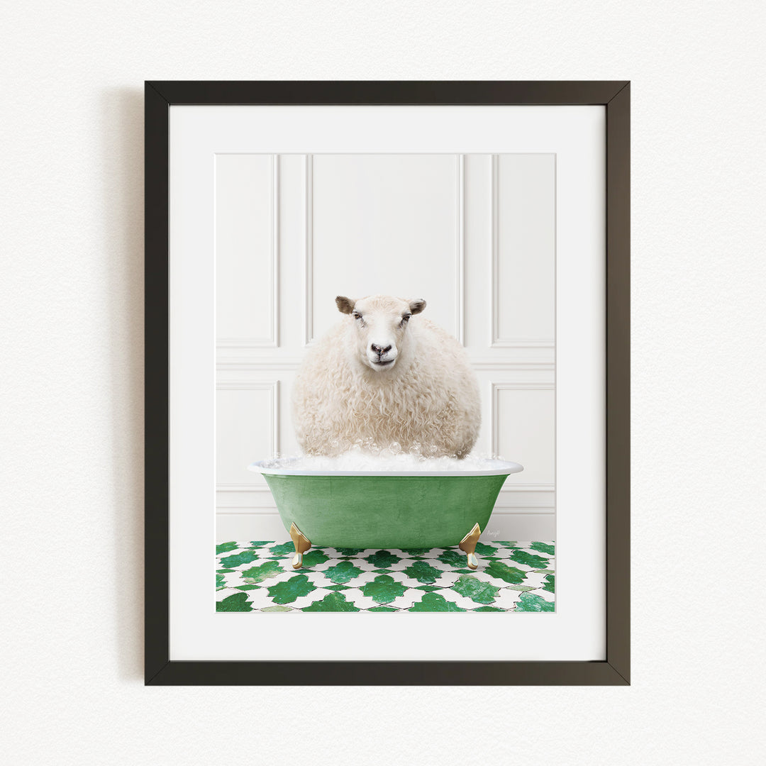 A fluffy white sheep sits in a green bathtub filled with bubbles, surrounded by a green and white patterned rug.