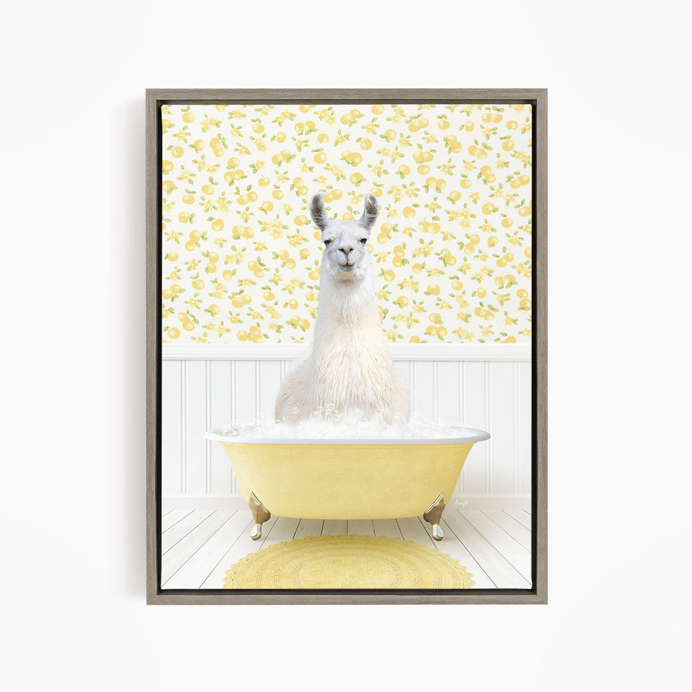 A white llama sitting in a yellow bathtub filled with bubbles, with a yellow and white floral wallpaper in the background.