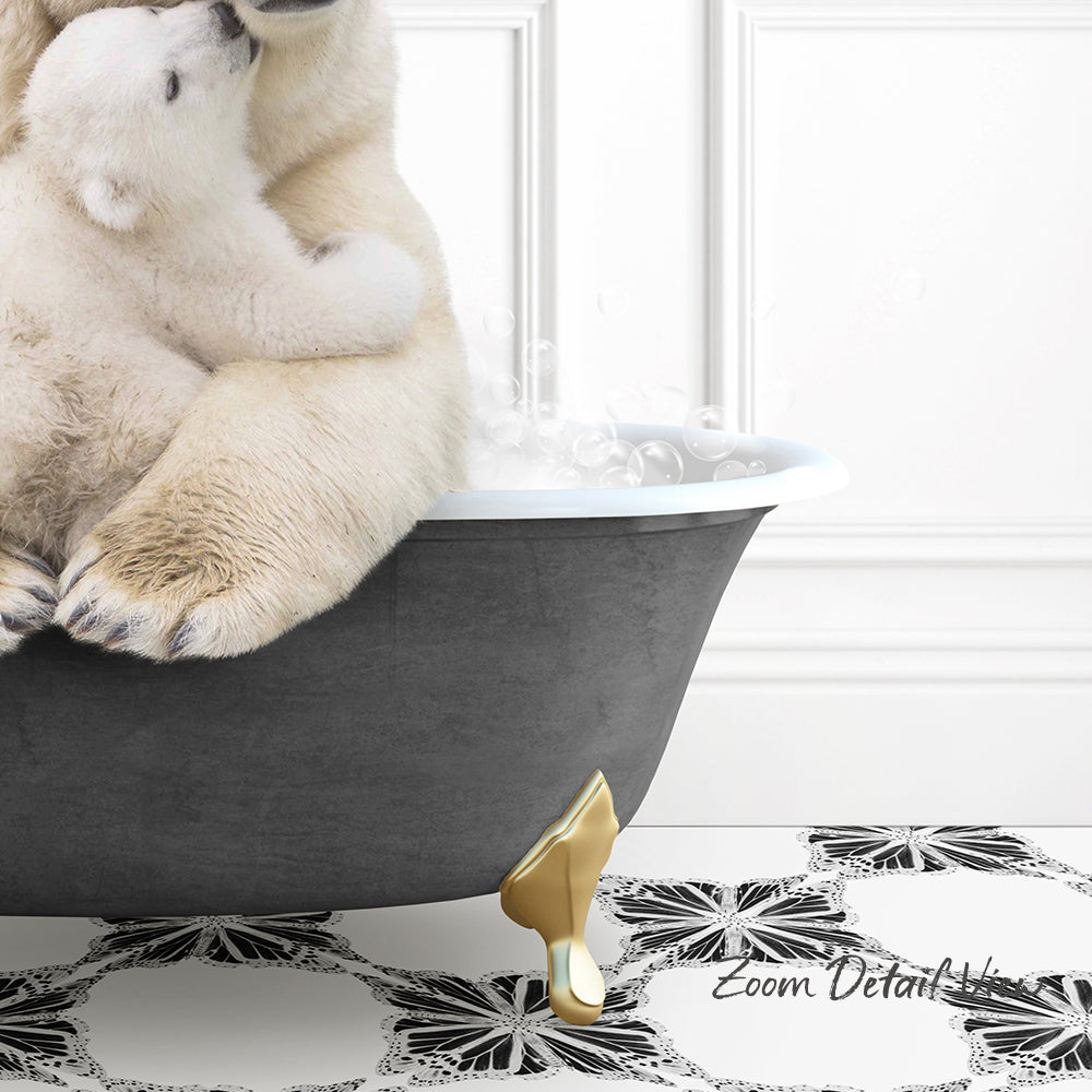 A polar bear sitting in a bathtub, with bubbles around it, and a gold bathtub leg visible.