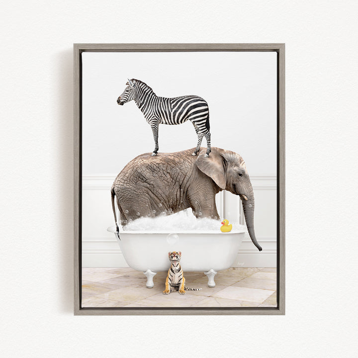 A zebra stands on the back of an elephant, which is sitting in a bathtub filled with bubbles, while a tiger sits nearby.
