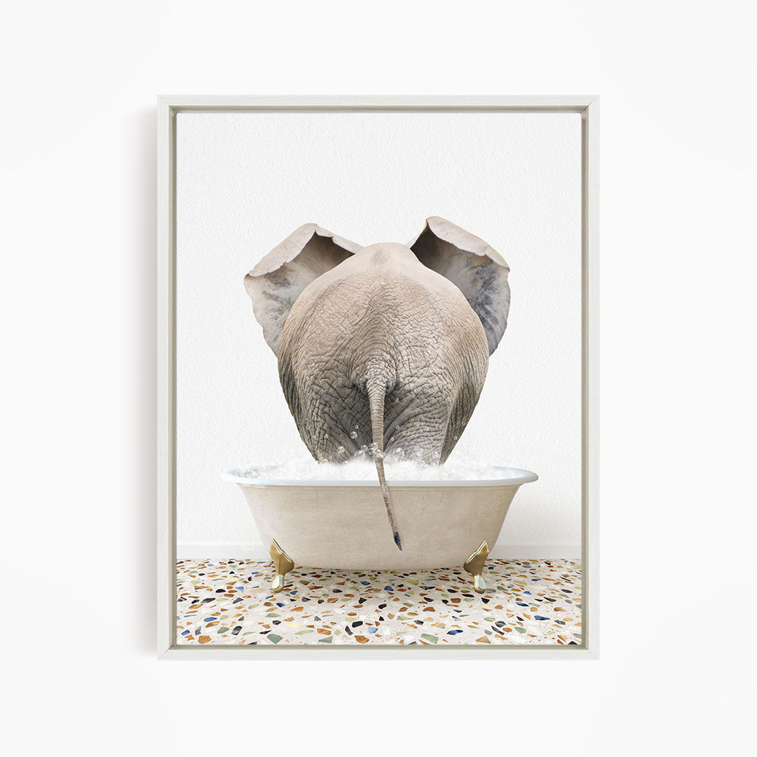 A large gray elephant is standing in a white bathtub filled with water, with its back turned to the viewer.