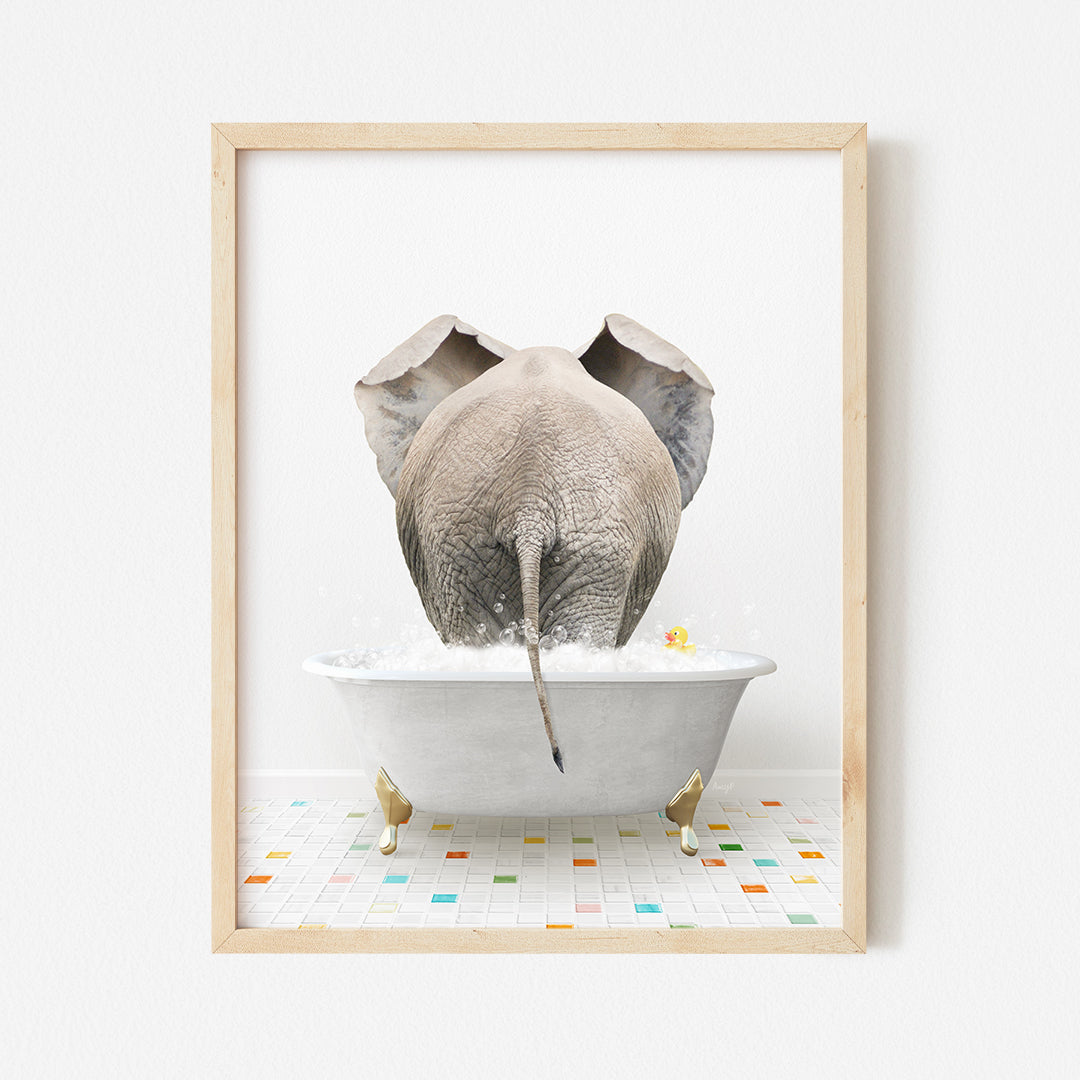 a picture of an elephant taking a bath