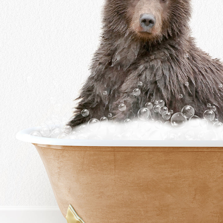 a brown bear sitting in a bathtub filled with bubbles