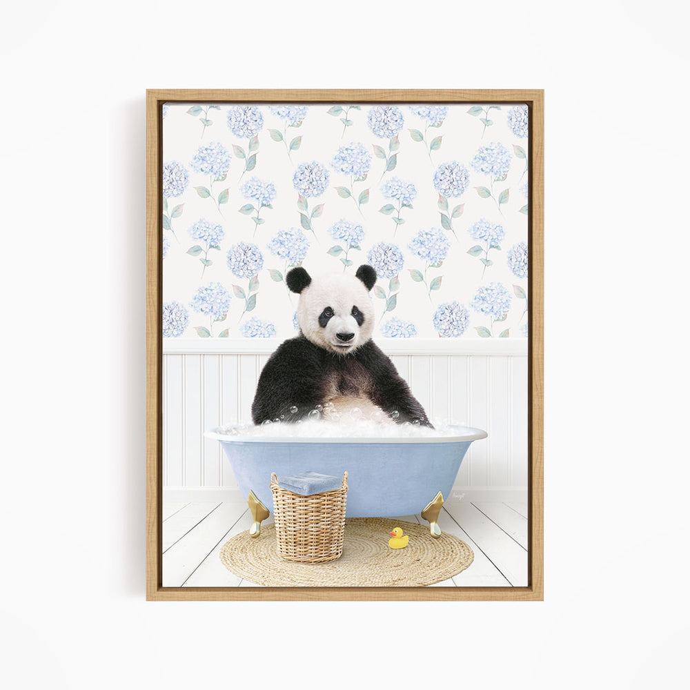 A panda bear sitting in a blue bathtub filled with bubbles, surrounded by a wicker basket and rubber duckies.