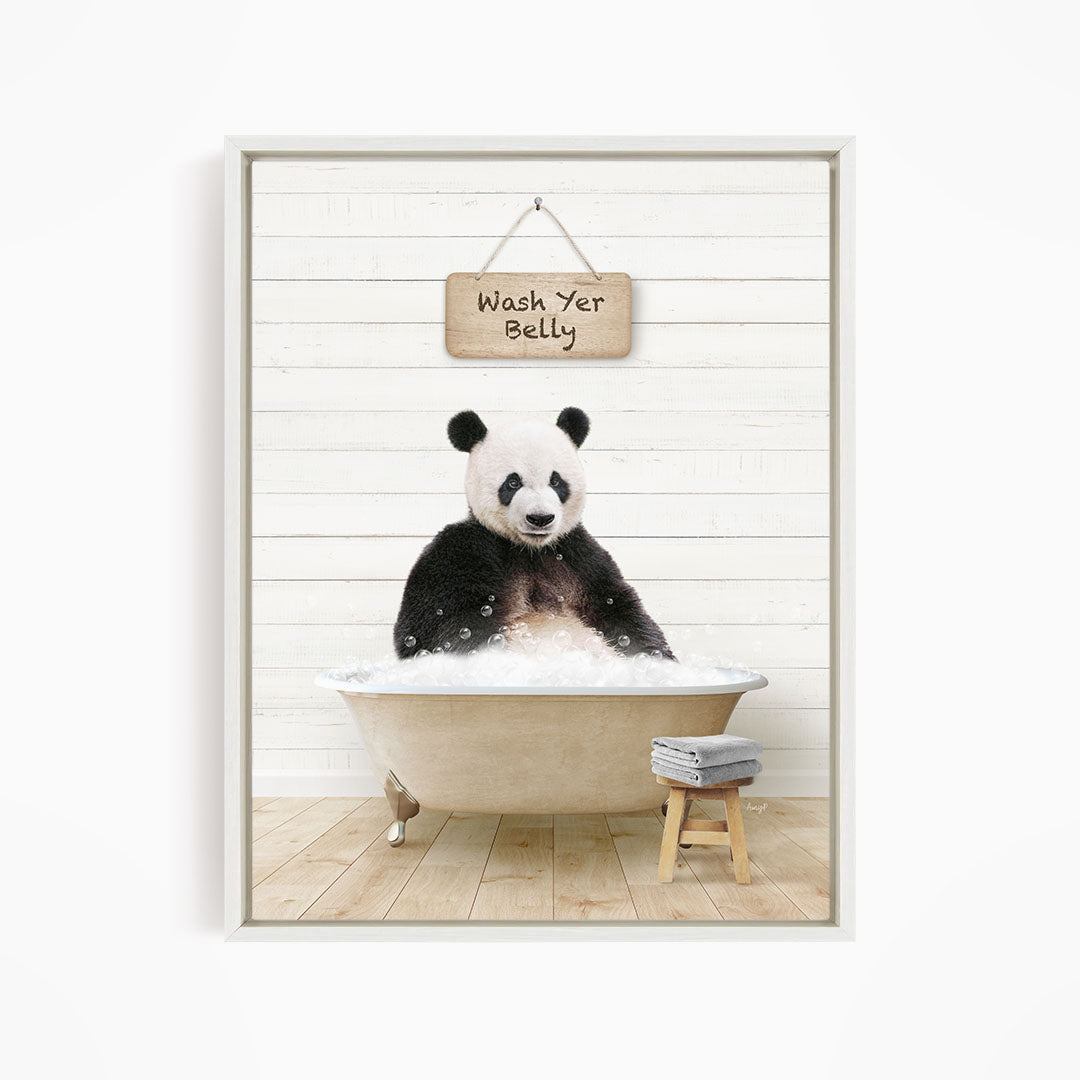 A panda bear sitting in a bathtub, with a sign above that says "Wash Yer Belly".