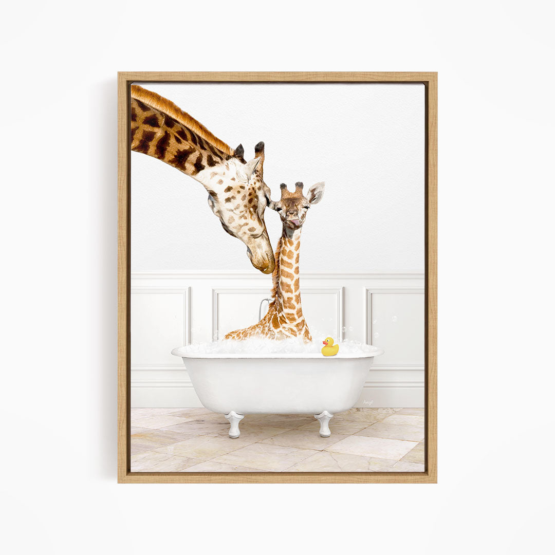 A mother giraffe and her baby giraffe are sitting together in a white bathtub, with a yellow rubber duck floating in the water.