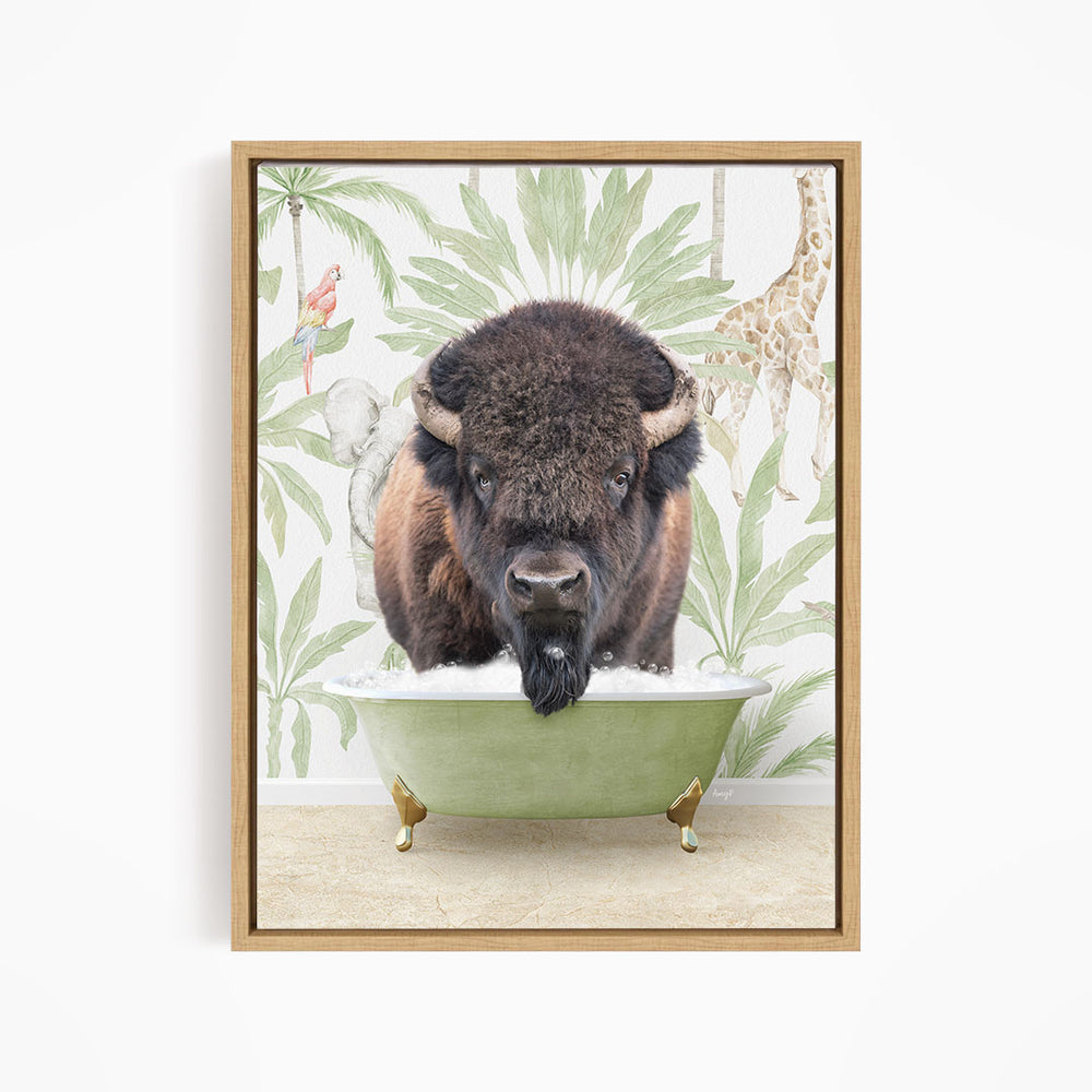 A buffalo is sitting in a green bathtub, surrounded by tropical foliage and a giraffe in the background.