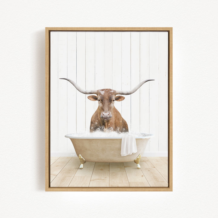 A brown cow with large horns is sitting in a bathtub filled with water, creating a whimsical and humorous scene.