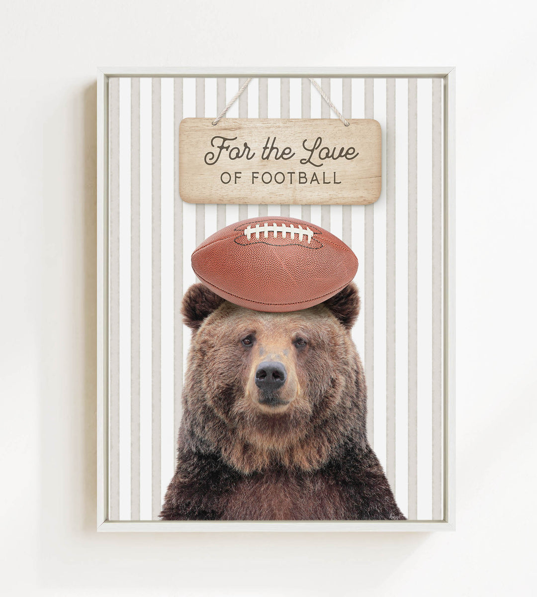 A brown bear wearing a football helmet and standing in front of a sign that says "For the Love of Football".