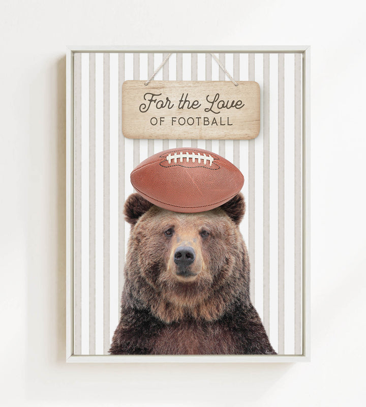 A brown bear wearing a football helmet and standing in front of a sign that says "For the Love of Football".