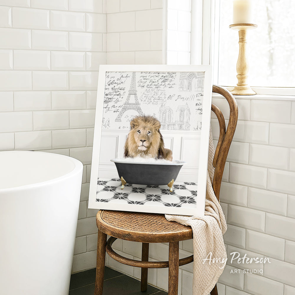 A framed image of a lion sitting in a bathtub, with a tiled wall and a window in the background.