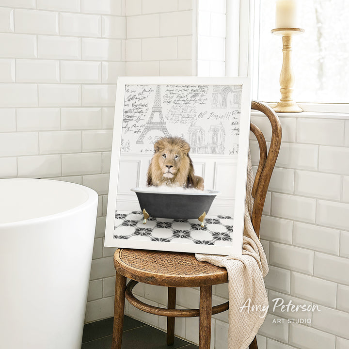 A framed image of a lion sitting in a bathtub, with a tiled wall and a window in the background.