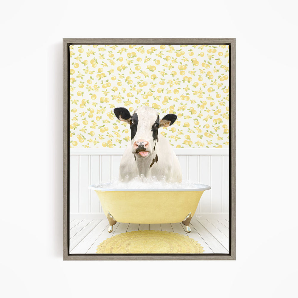 A black and white cow is sitting in a yellow bathtub filled with water, surrounded by a yellow floral wallpaper.