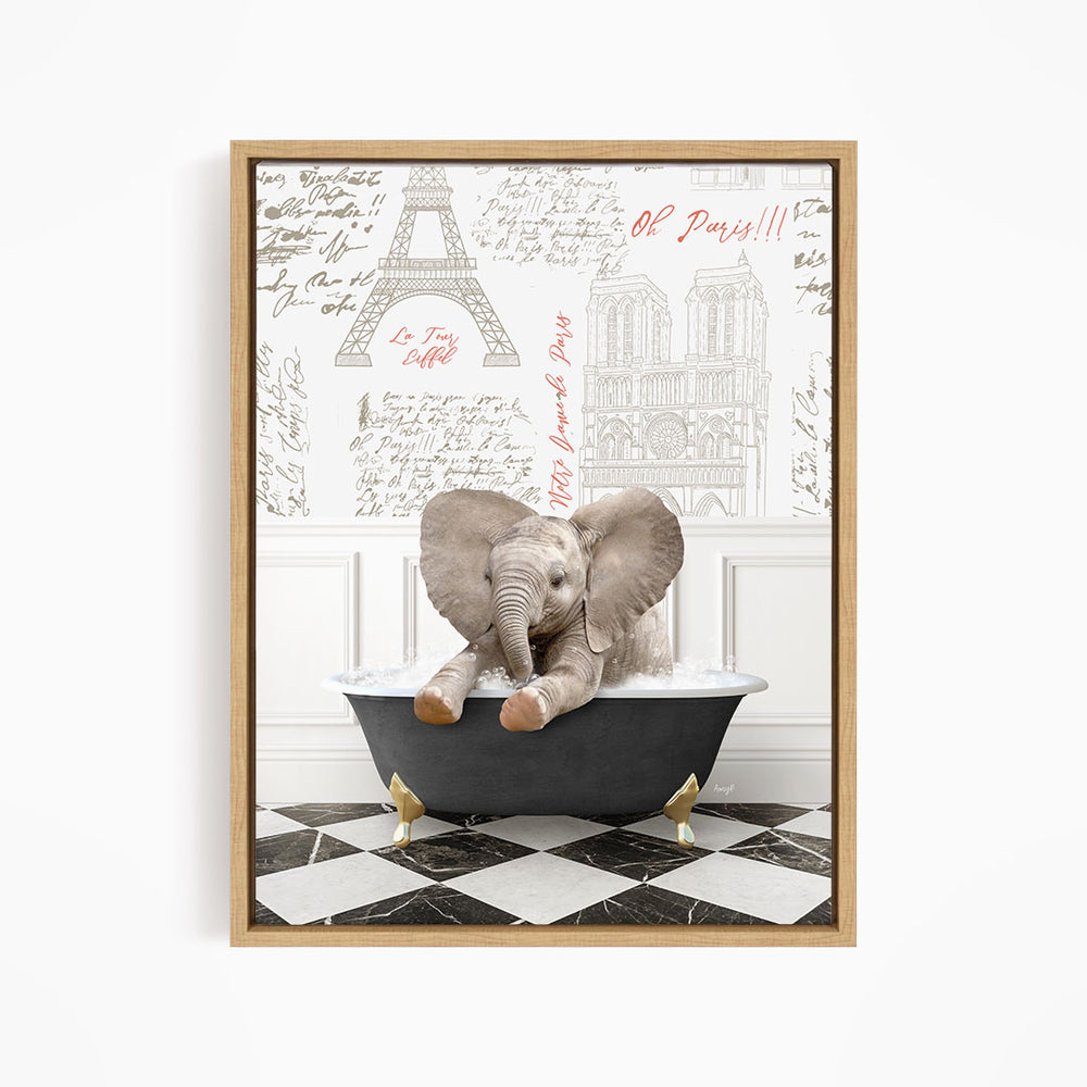 A framed image depicting a baby elephant sitting in a bathtub, surrounded by various Paris-themed elements such as the Eiffel Tower and other landmarks.