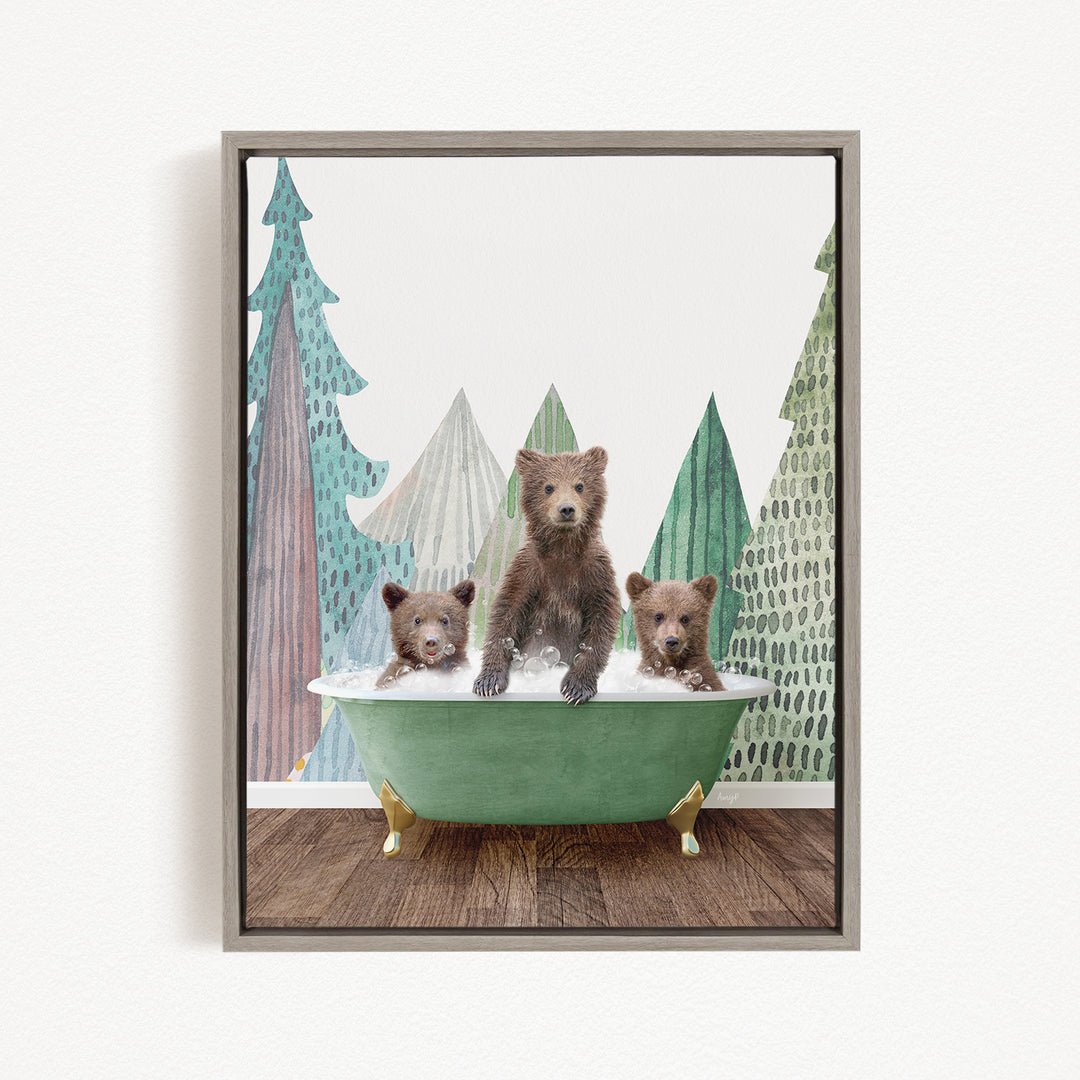 A framed image depicting three bears sitting in a green bathtub, with a forest backdrop.