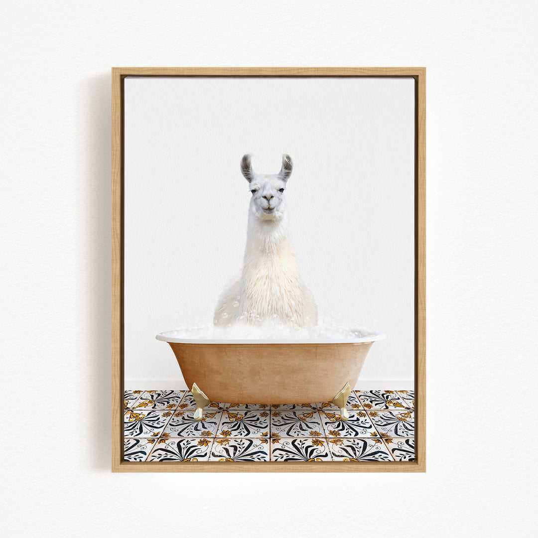 A white llama sitting in a bathtub filled with bubbles, surrounded by a patterned tile floor.