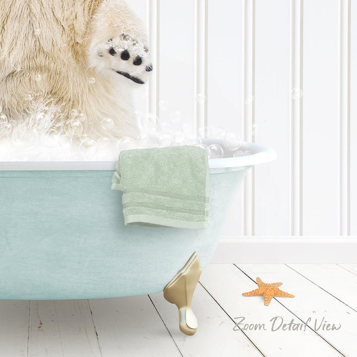 A polar bear is standing in a bathtub filled with bubbles, with a towel and starfish nearby.