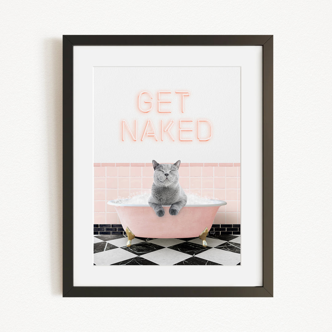 A framed image depicting a gray cat sitting in a pink bathtub, with the text "GET NAKED" displayed above it.