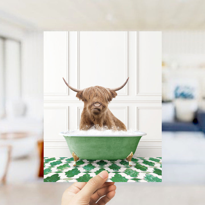 A brown cow with long horns is sitting in a green bathtub filled with bubbles, surrounded by a green and white patterned floor.