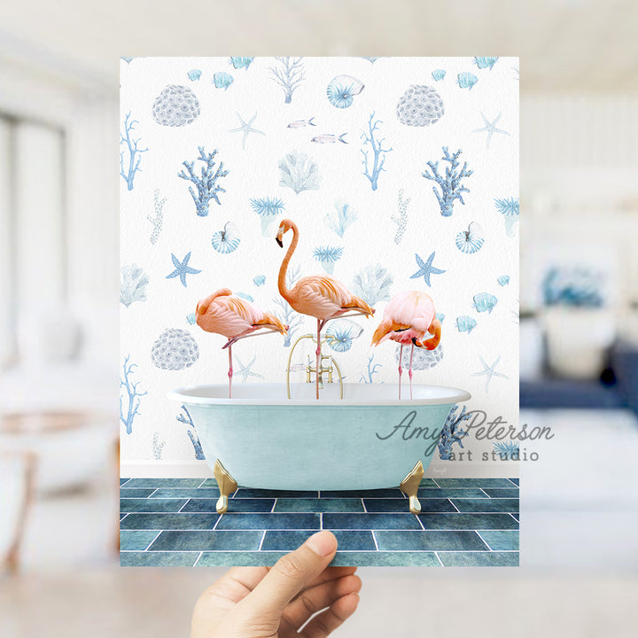 a person holding up a card with flamingos in a bathtub