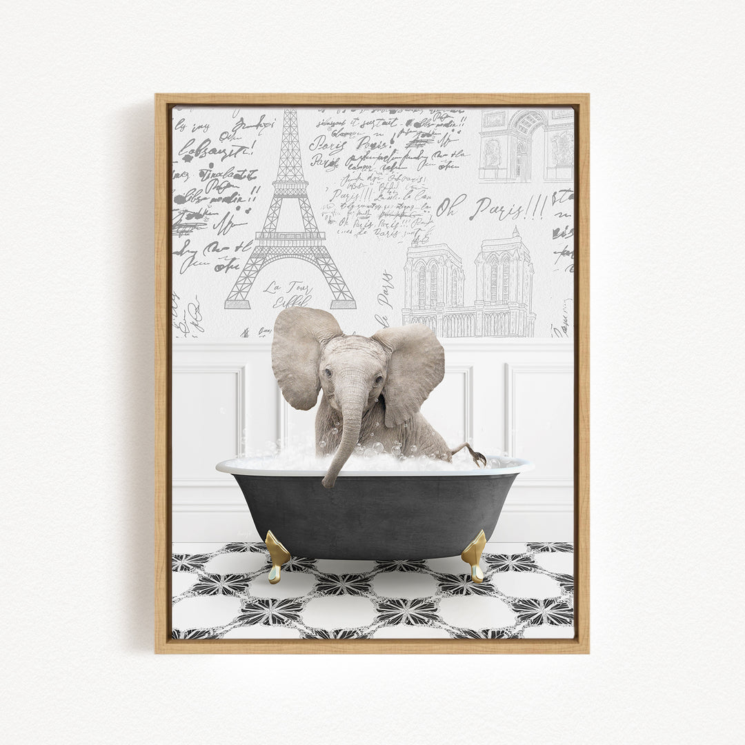 A gray elephant is sitting in a bathtub filled with water, surrounded by a black and white patterned floor and a wall with various inscriptions and illustrations, including the Eiffel Tower.
