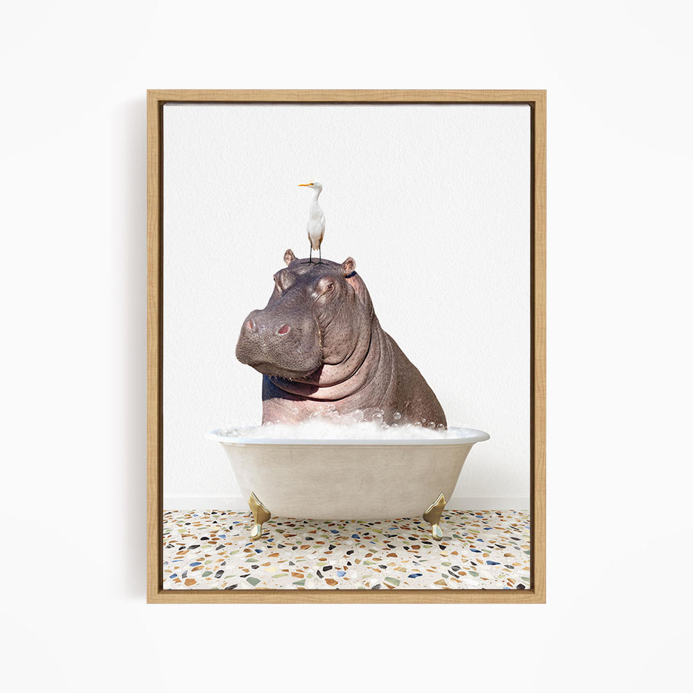 A seagull stands on the head of a hippopotamus sitting in a bathtub filled with water.