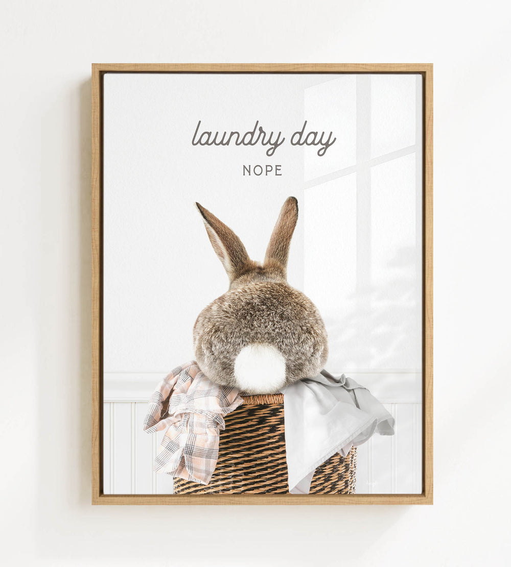 A picture of a rabbit sitting in a basket, with the text "laundry day NOPE" above it.
