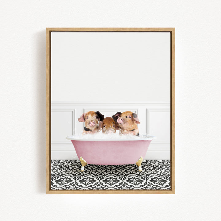 Three adorable pigs sitting in a pink bathtub, enjoying a bath together.