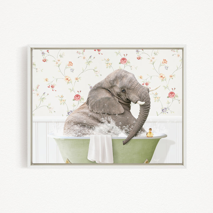 A gray elephant is sitting in a green bathtub filled with water, surrounded by a floral patterned wall.