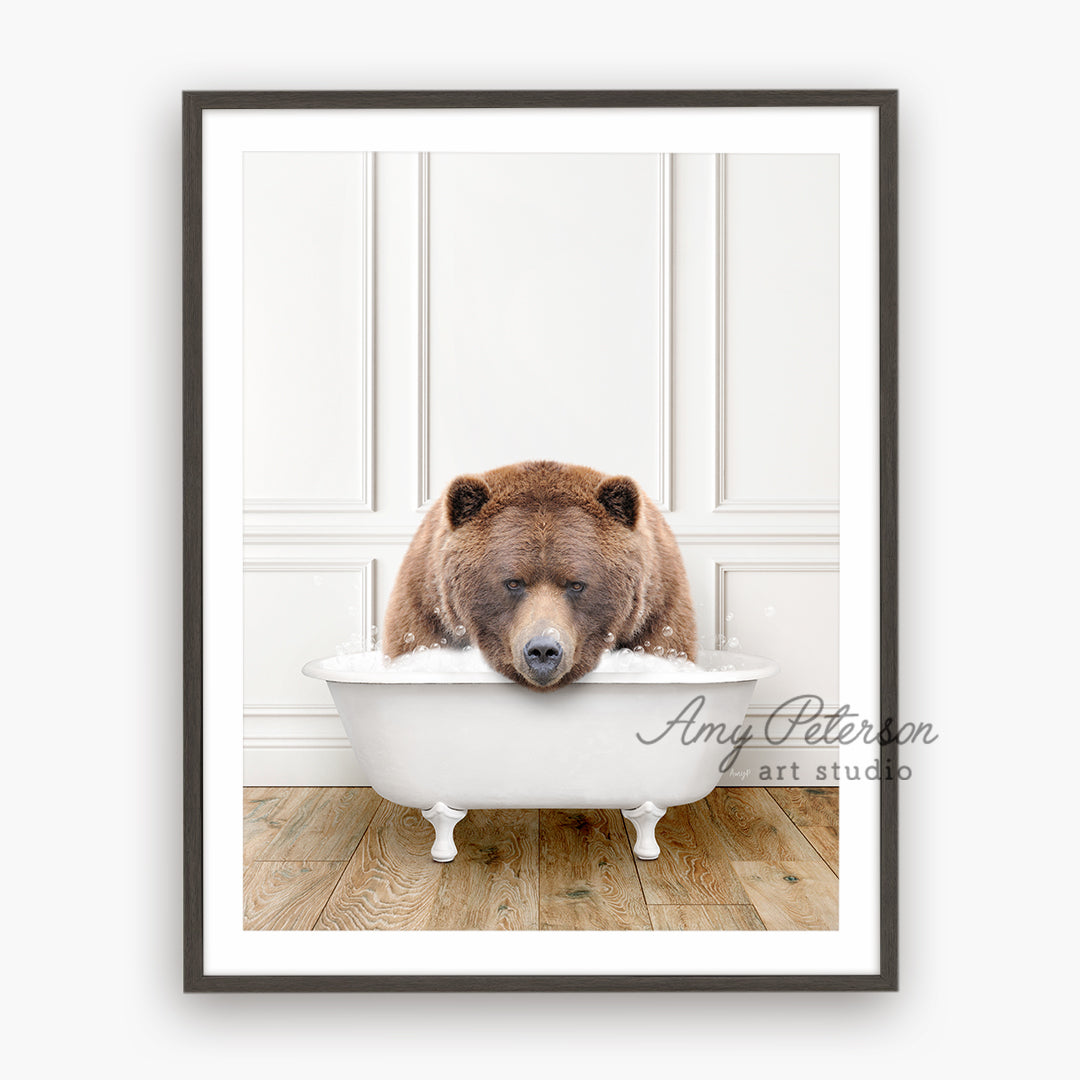 a brown bear sitting in a bath tub