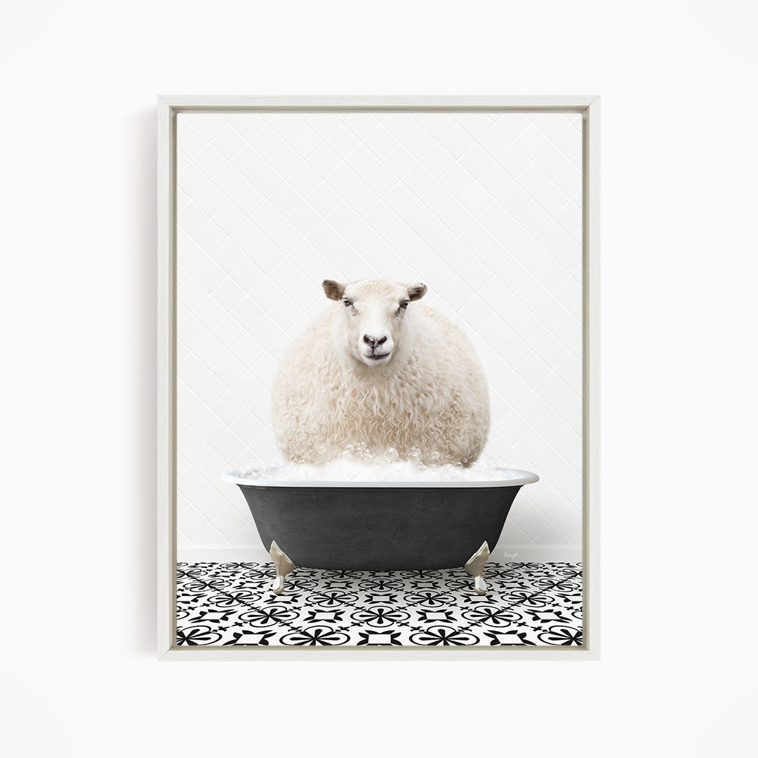 A fluffy white sheep sits in a black bathtub filled with bubbles, creating a whimsical and amusing scene.