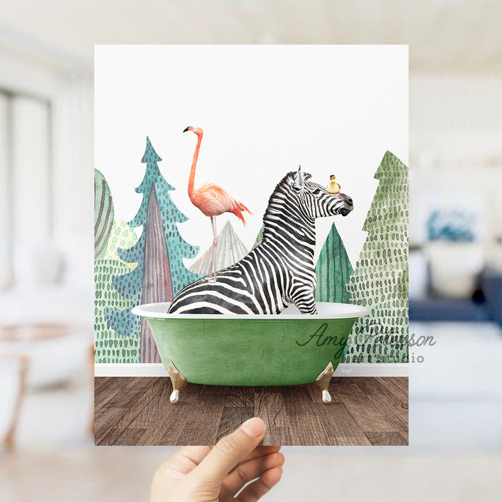 a hand holding up a card with a zebra and flamingo in a bathtub