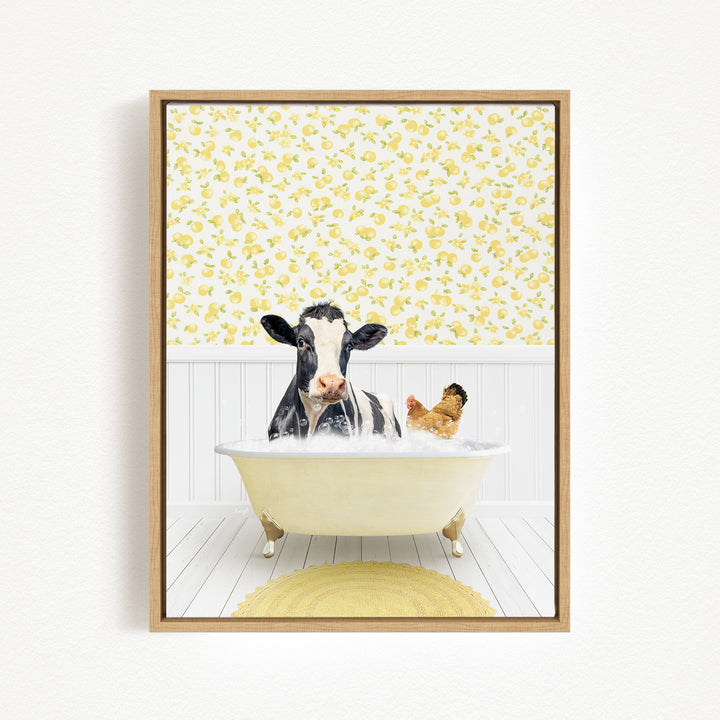 A black and white cow is sitting in a bathtub filled with water, with a chicken nearby, in a room with yellow floral wallpaper.