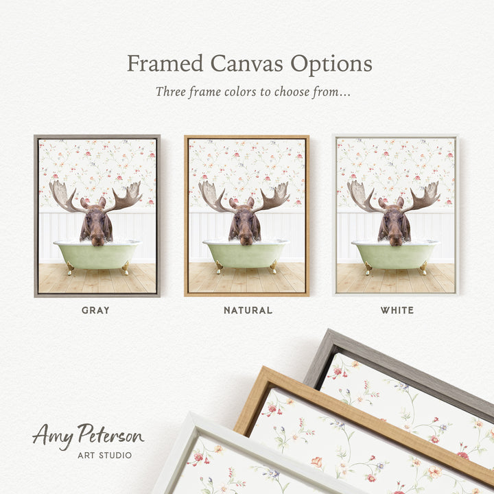 three framed canvas options featuring a moose in a bathtub, with each option having a different frame color: gray, natural, and white.