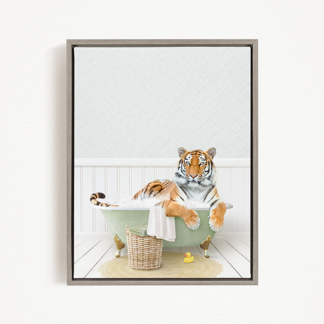 A tiger is sitting in a green bathtub filled with water, surrounded by a basket and a rubber duck.