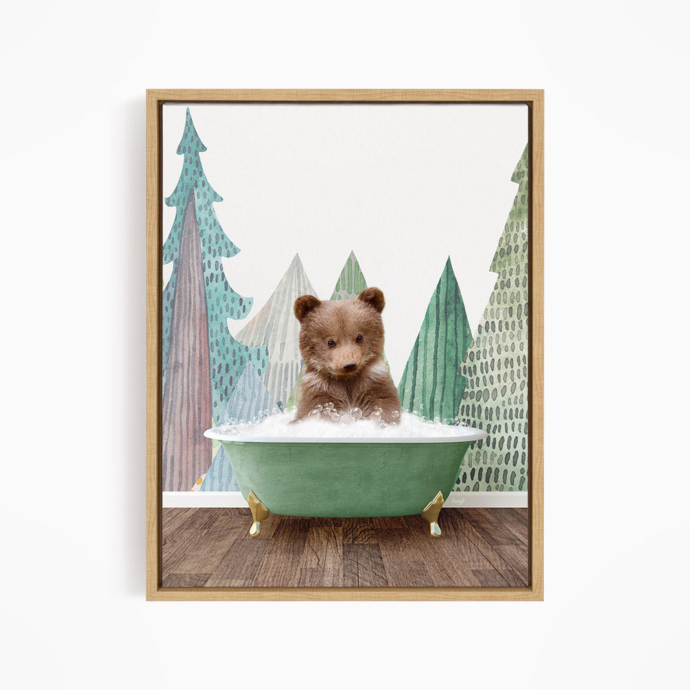A brown bear sitting in a green bathtub, surrounded by a forest scene with trees and a snowy landscape.