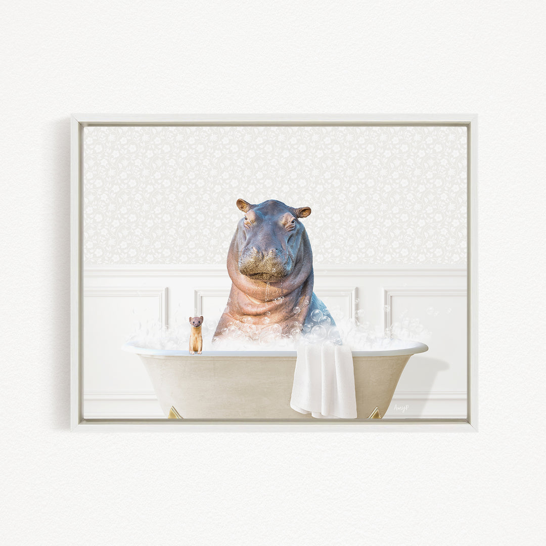 A hippopotamus sitting in a bathtub filled with water, surrounded by bubbles, with a small cat nearby.