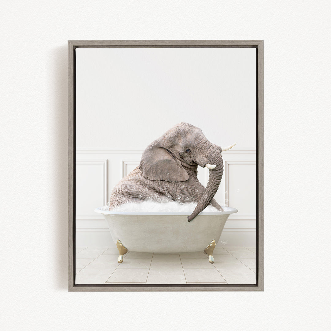 A gray elephant sitting in a white bathtub filled with bubbles, with its trunk raised in the air.