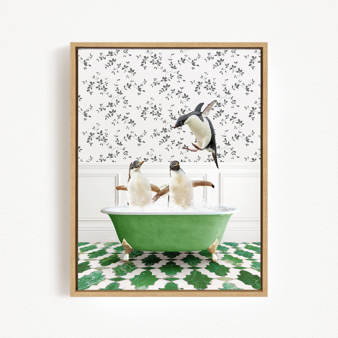 A framed image depicting three penguins sitting in a green bathtub, with one penguin flying towards the tub.