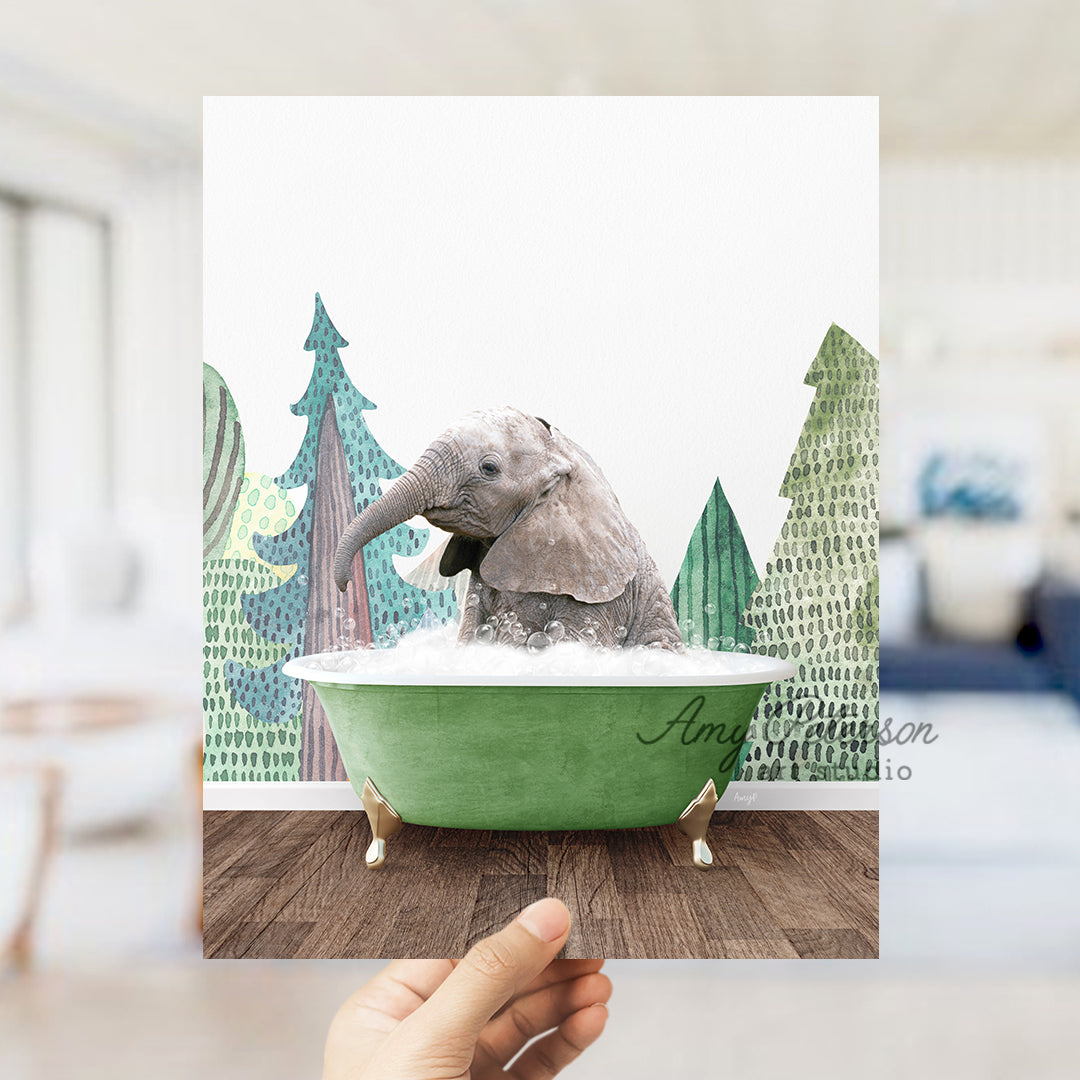 a person holding up a picture of an elephant in a bathtub