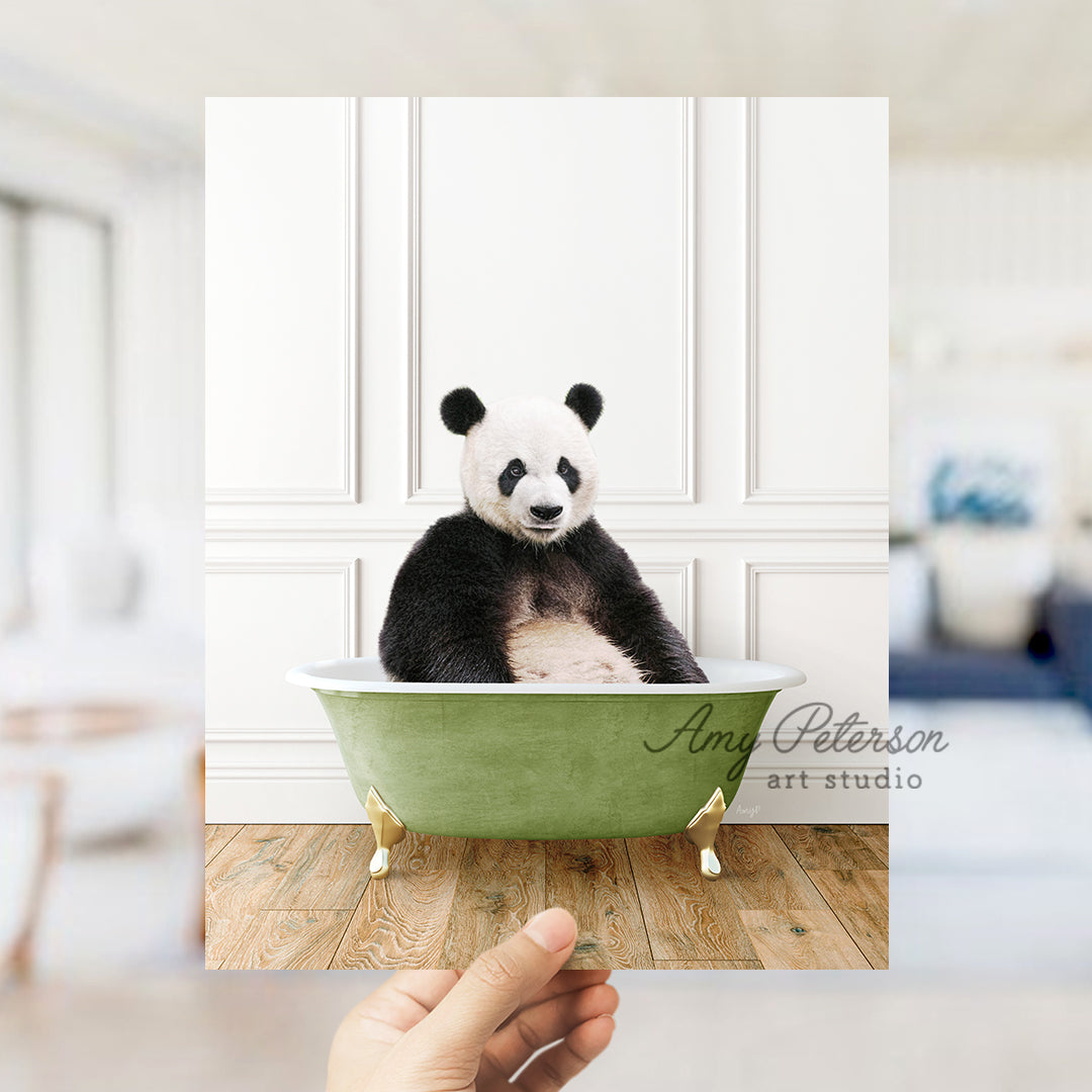 a panda bear sitting in a green bath tub