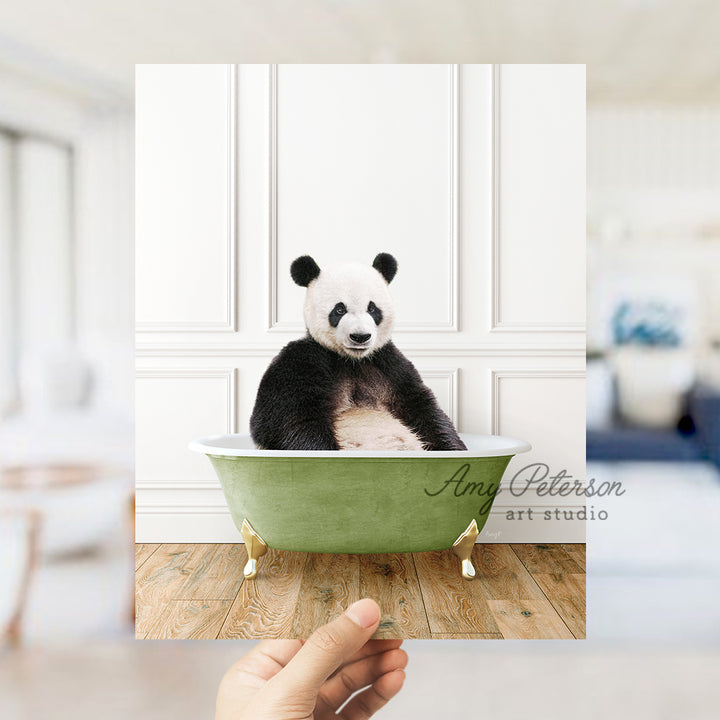 a panda bear sitting in a green bath tub