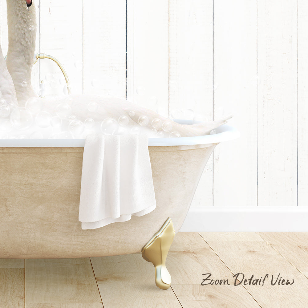 A person relaxing in a bathtub filled with bubbles, with a towel and gold bathtub faucet visible.