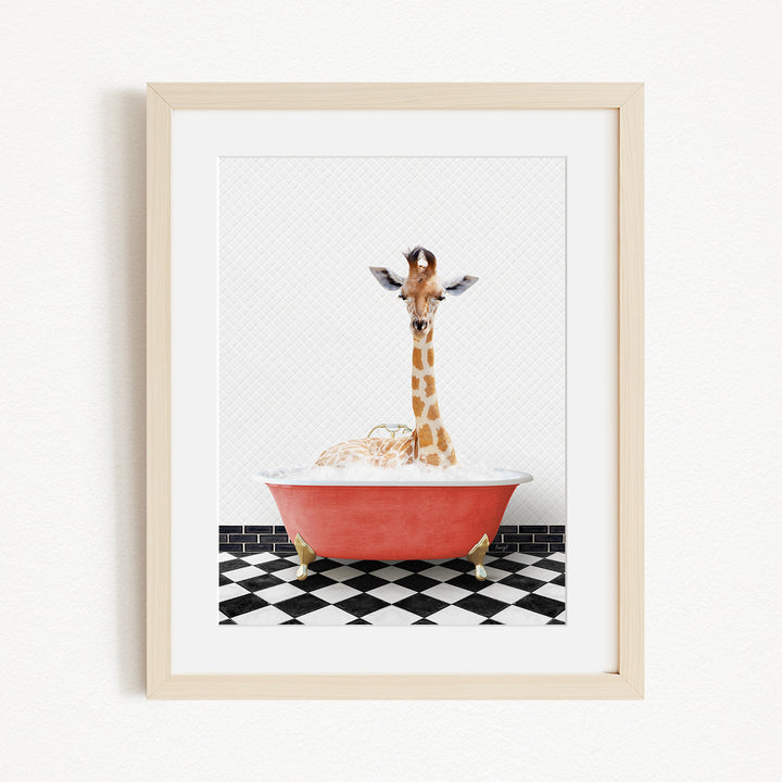 A giraffe standing in a red bathtub filled with bubbles, with a black and white checkered floor beneath it.